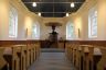 De kerk in de kleuren zoals besproken met bestuur en subsidie verstrekkers. De later vervangen groene franje zit hier nog op de preekstoel. Het geheel ademt rust en ingetogenheid uit.